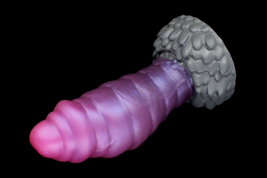Mothman cryptid silicone dildo from Lycantasy.com - photo showcasing the signature coloration, with a pink tip faded to a metallic purple shaft, and a gray base!